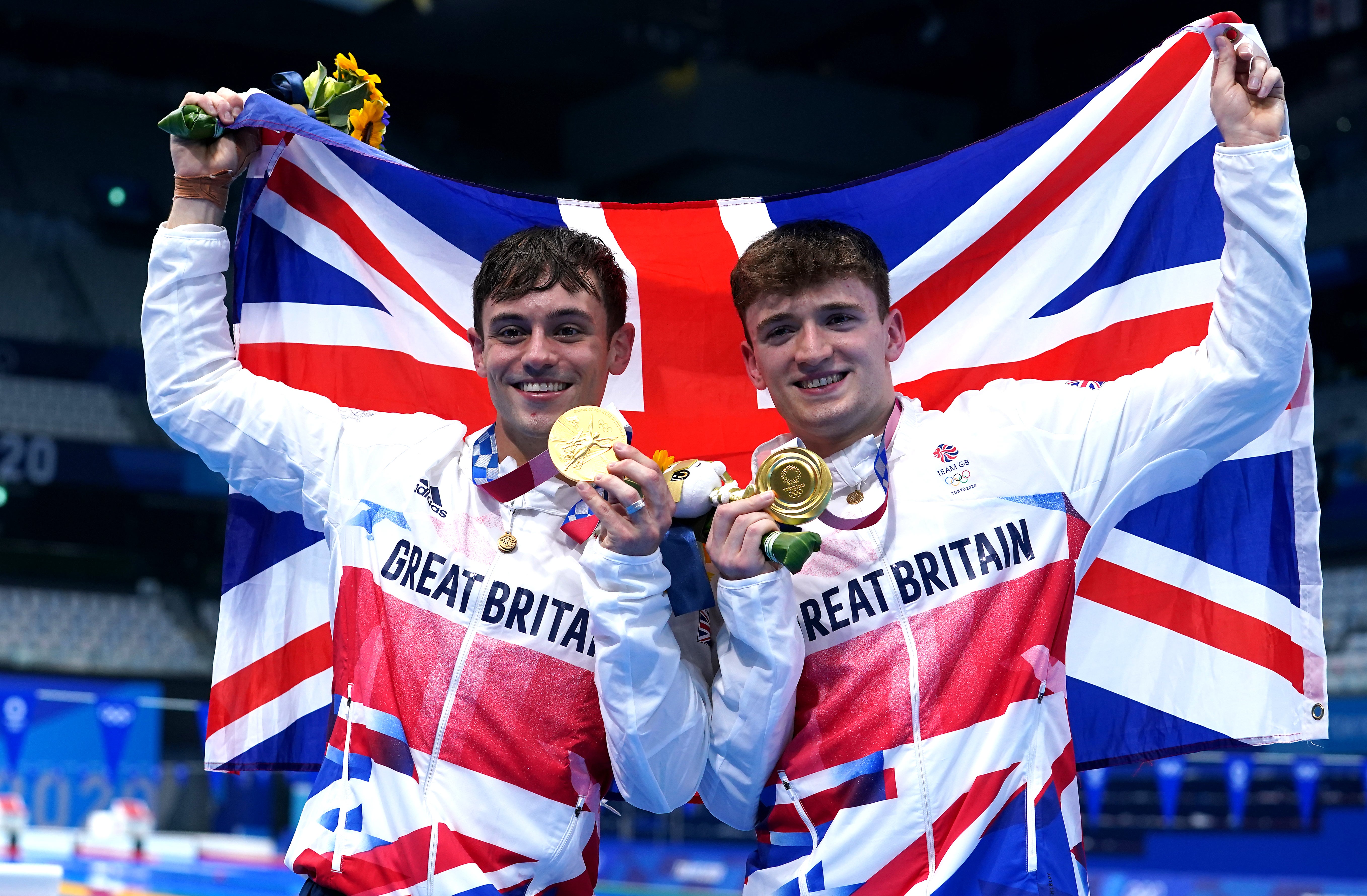 Tom Daley (left) and Matty Lee celebrate winning gold in the men’s synchronised 10m platform on day three (Adam Davy/PA)
