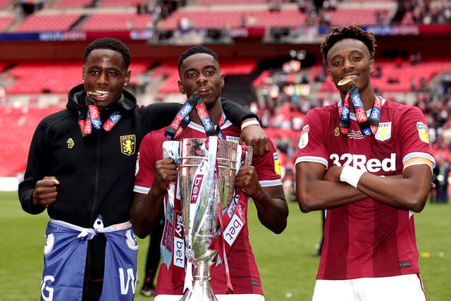 Manchester United defender Axel Tuanzebe, centre, helped Aston Villa reach the Premier League in 2019 and will have a second loan spell at the club (John Walton/PA)