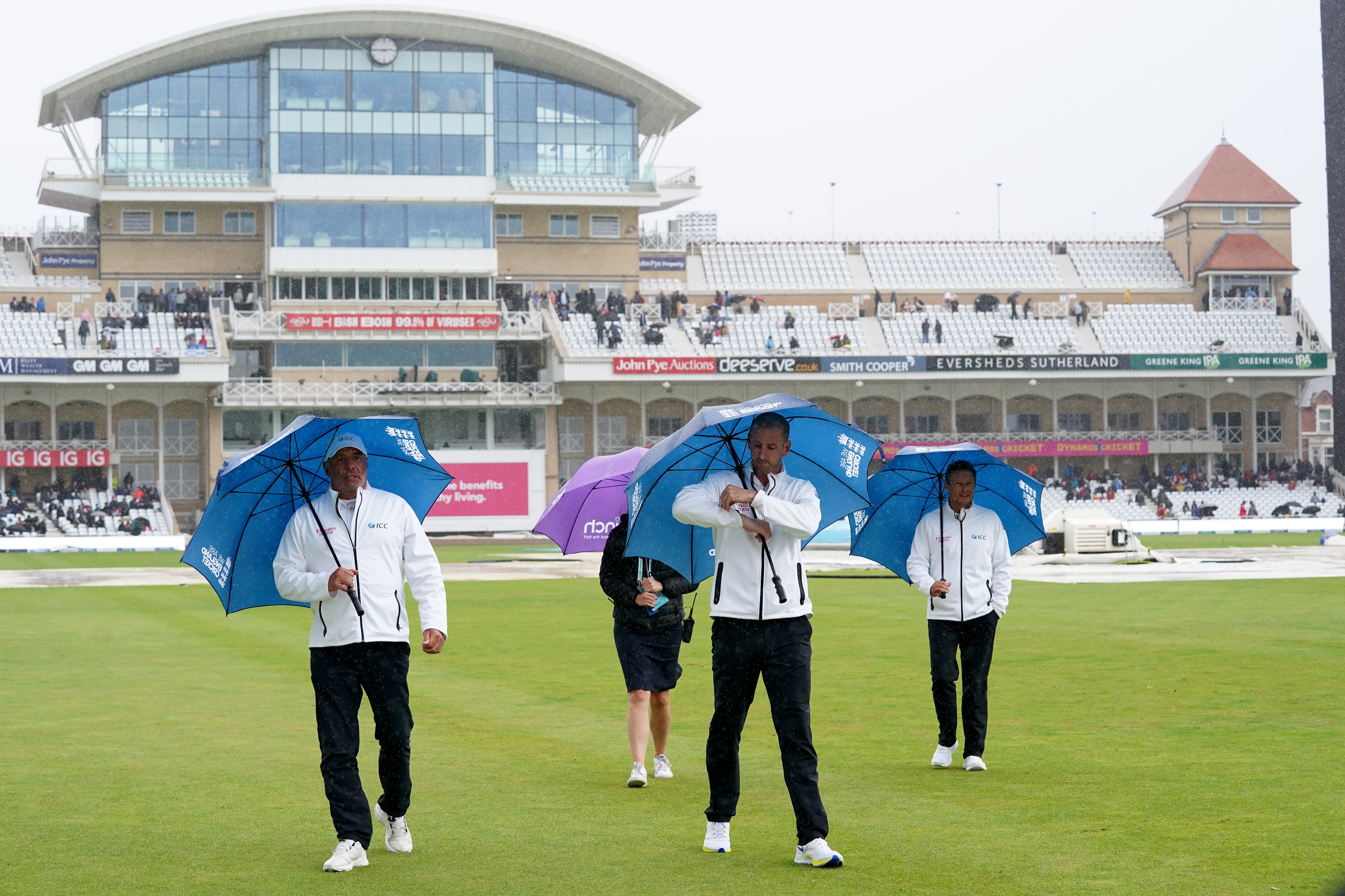 Umpires Michael Gough (centre) and Richard Kettleborough (right) called off the first Test at 3.49pm after a pitch inspection (Tim Goode/PA)