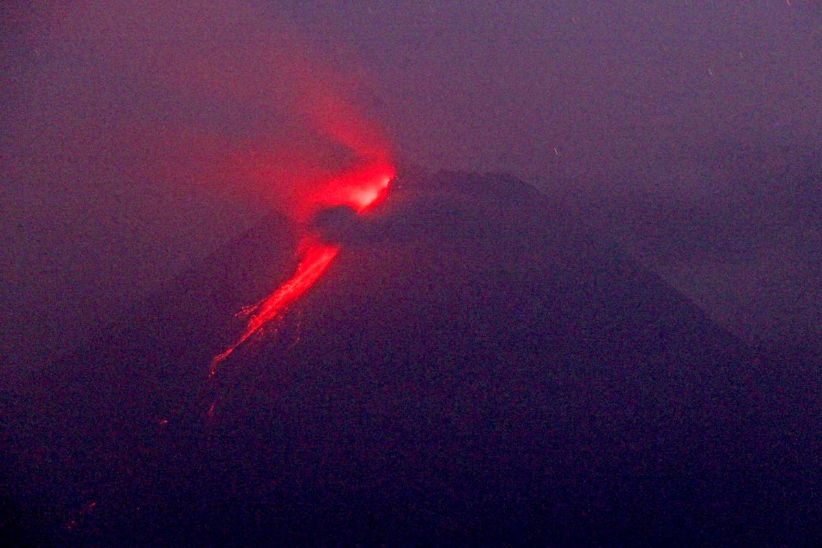 Indonesian volcano churns out fresh clouds of ash, lava