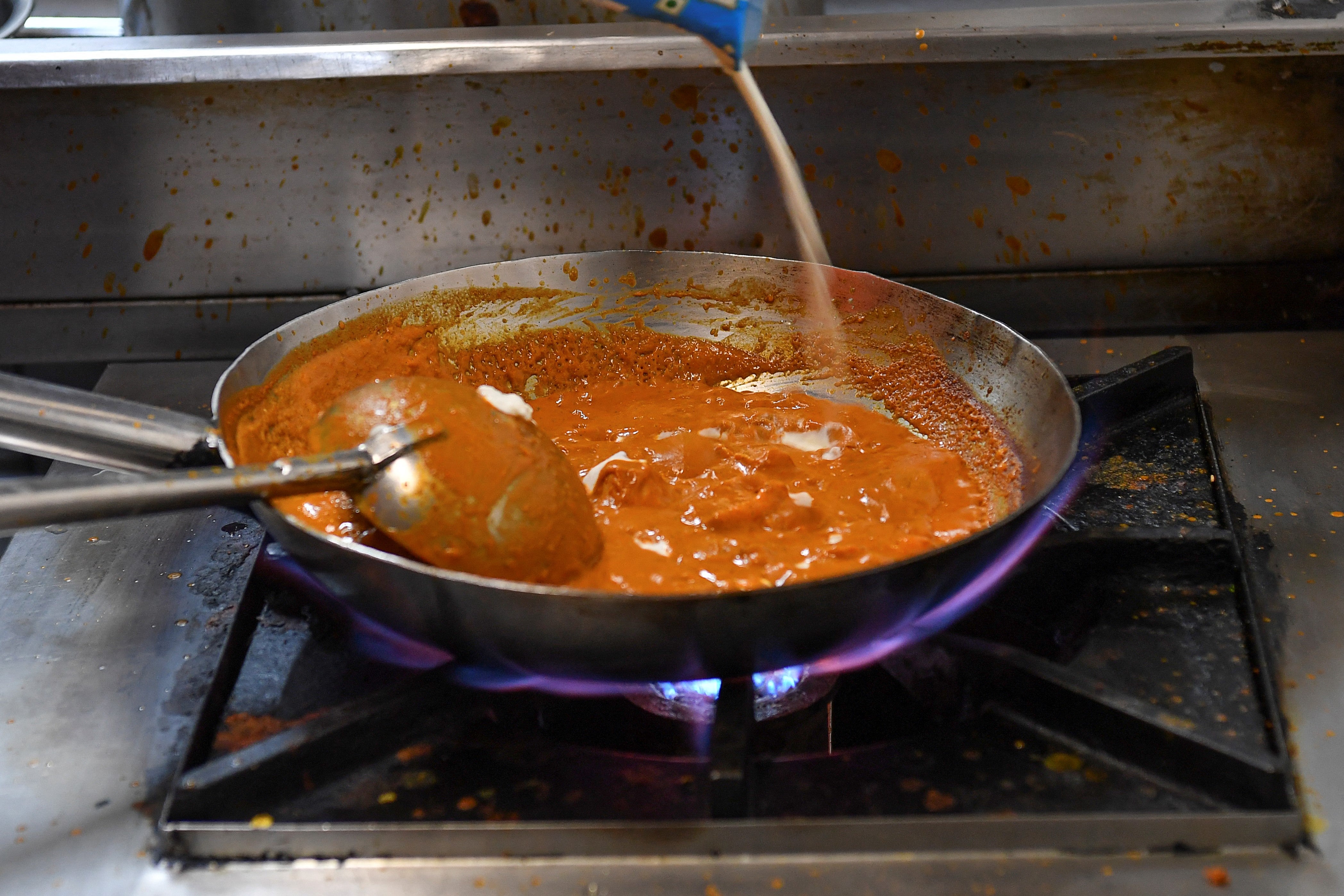 <p>File image: Indian chef Saransh Goila prepares a dish at the Goila Butter Chicken restaurant in Mumbai</p>