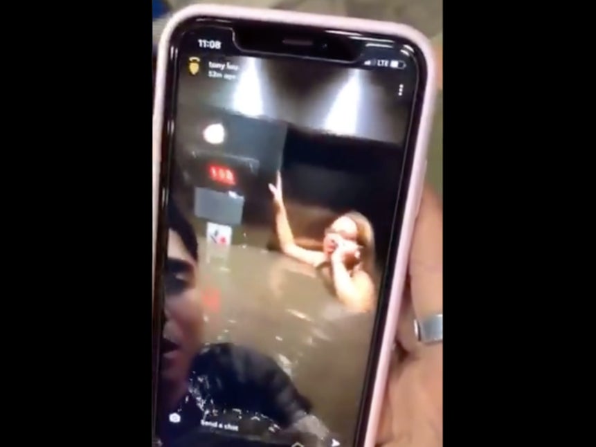 A video captured by Tony Luu, a radio producer in Omaha, shows people stuck in an elevator flooded with water