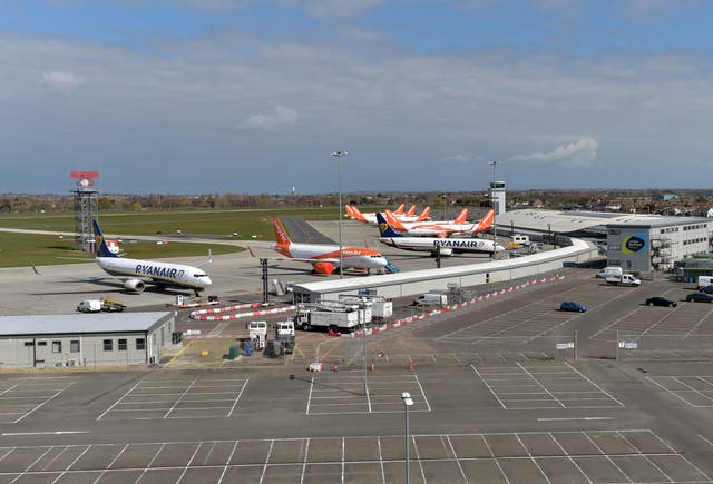 <p>Ryanair and easyJet aircraft parked near an empty long stay car park at Southend airport</p>