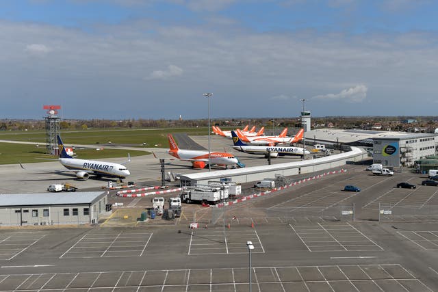 <p>Ryanair and easyJet aircraft parked near an empty long stay car park at Southend airport</p>