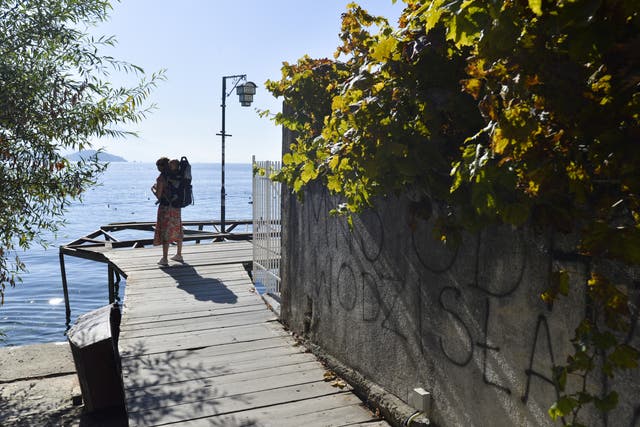 <p>Baby on board: Stopping to catch the view at North Macedonia’s Lake Ohrid</p>