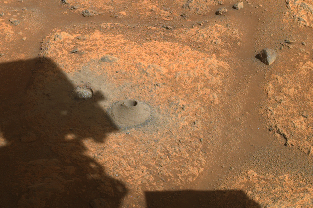 <p>This image taken by one the hazard cameras aboard NASA’s Perseverance rover on Aug. 6, 2021, shows the hole drilled in what the rover’s science team calls a “paver rock” in preparation for the mission’s first attempt to collect a sample from Mars</p>
