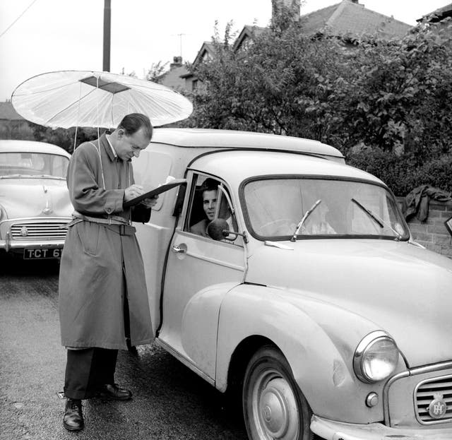 <p>A man collects census answers at a checkpoint in Dalton, Yorkshire, six decades ago</p>