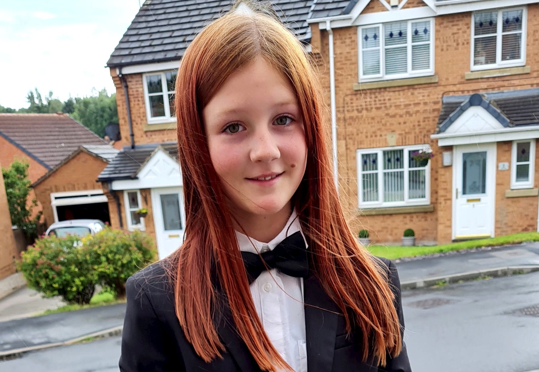 A mum has responded to parents 'sniggering' at her 11-year-old girl for  wearing a suit to her prom