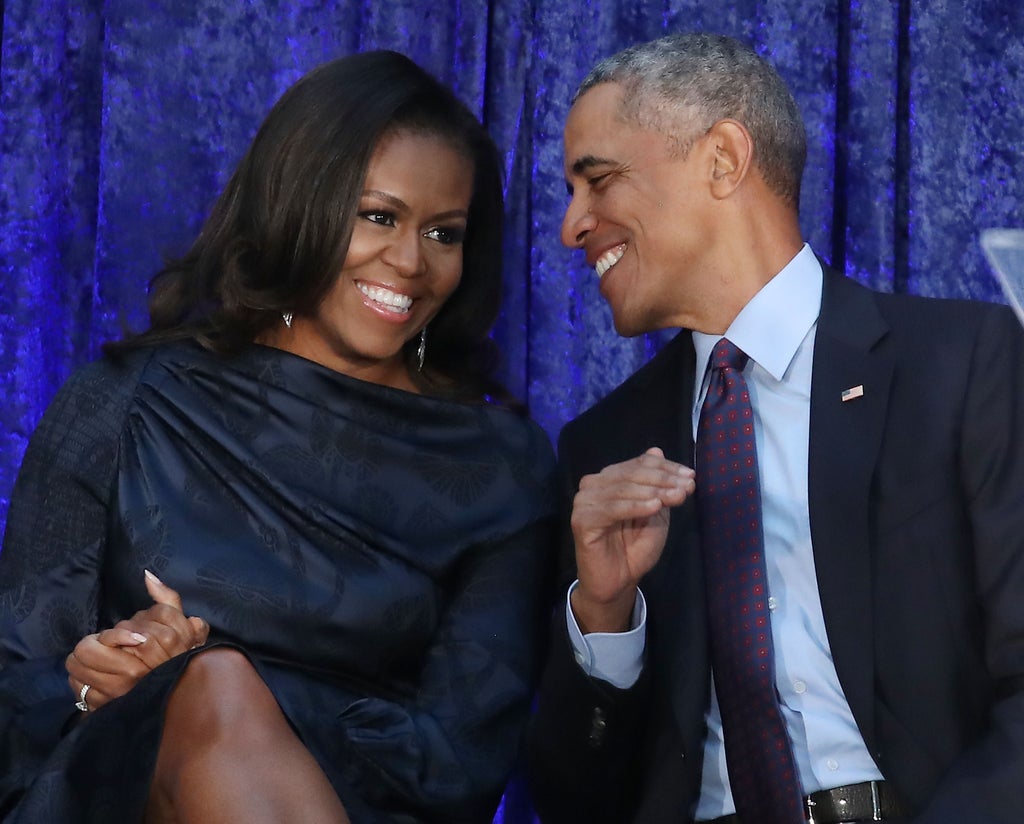 Michelle Obama wears green halter dress during Barack’s 60th birthday celebration