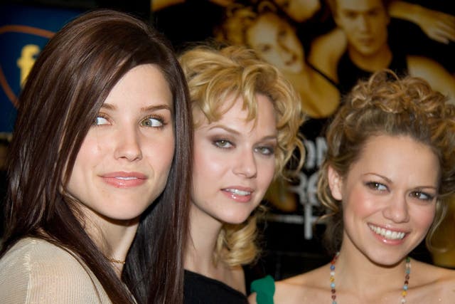 <p>Burton (centre) with ‘One Tree Hill’ co-stars Sophia Bush and Bethany Joy Lenz in 2003</p>
