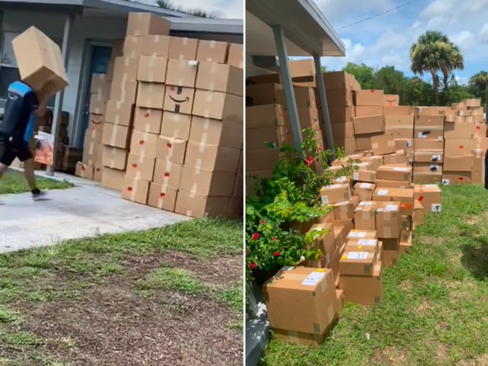 Pile of Amazon packages left in front of house leaves…