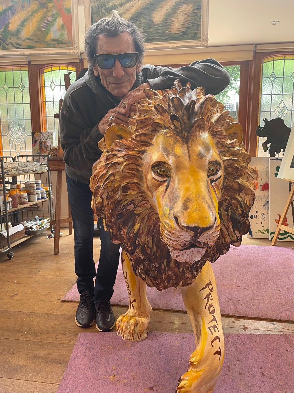 Ronnie Wood and his lion, Not Lying Lion (Tusk/PA)