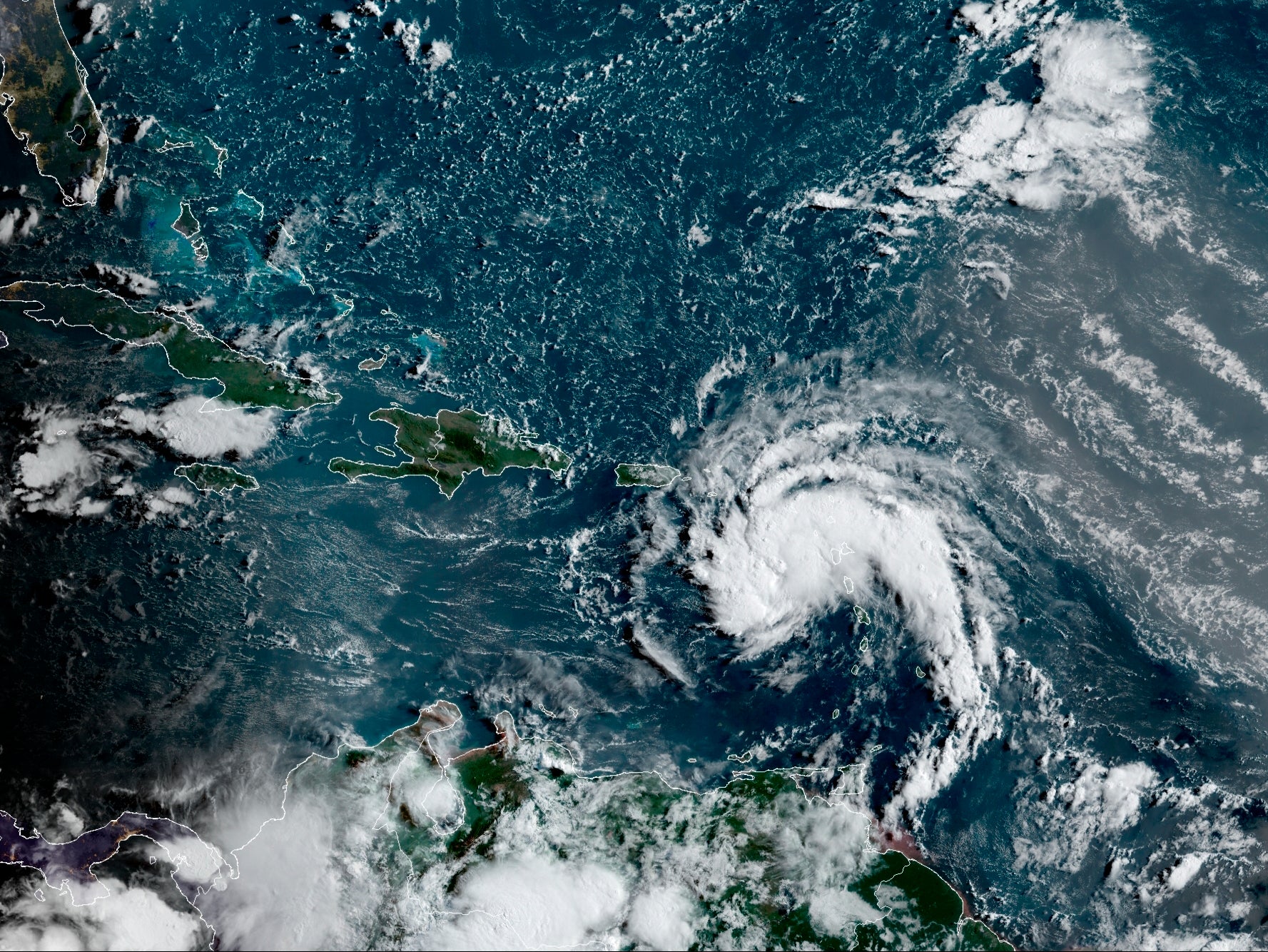 <p>Satellite image provided by the National Oceanic and Atmospheric Administration (NOAA) shows a tropical storm east of Puerto Rico in the Caribbean, at 7:50am EST, Tuesday, 10 August 2021</p>