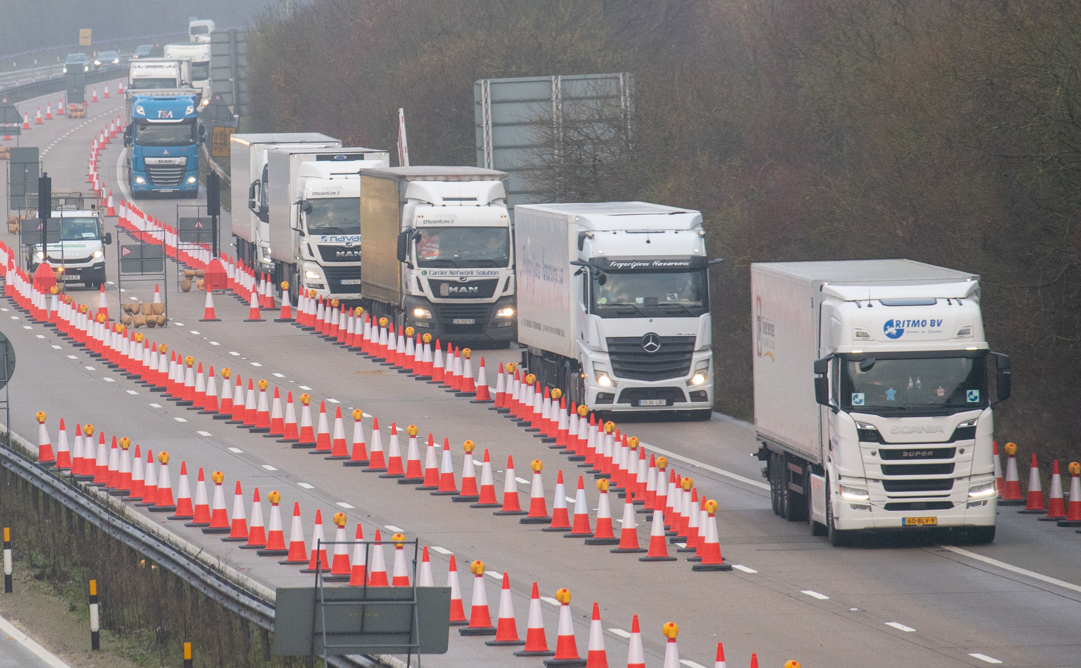 Freight lorries separated from other traffic on a Dover-bound section of the M20 motorway in Kent, during a live test by Highways England to mobilise Brock’s moveable barrier system in December 2020