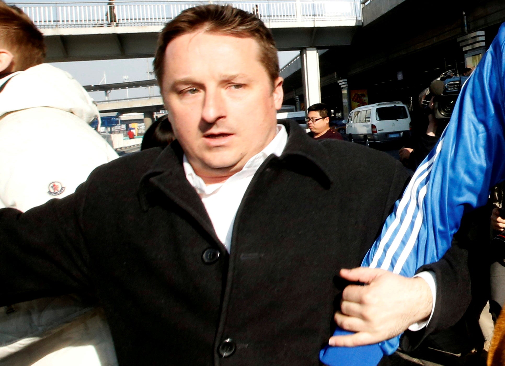 File Image: Canadian businessman Michael Spavor arriving at the Beijing International Airport after a trip to North Korea on 13 January 2014