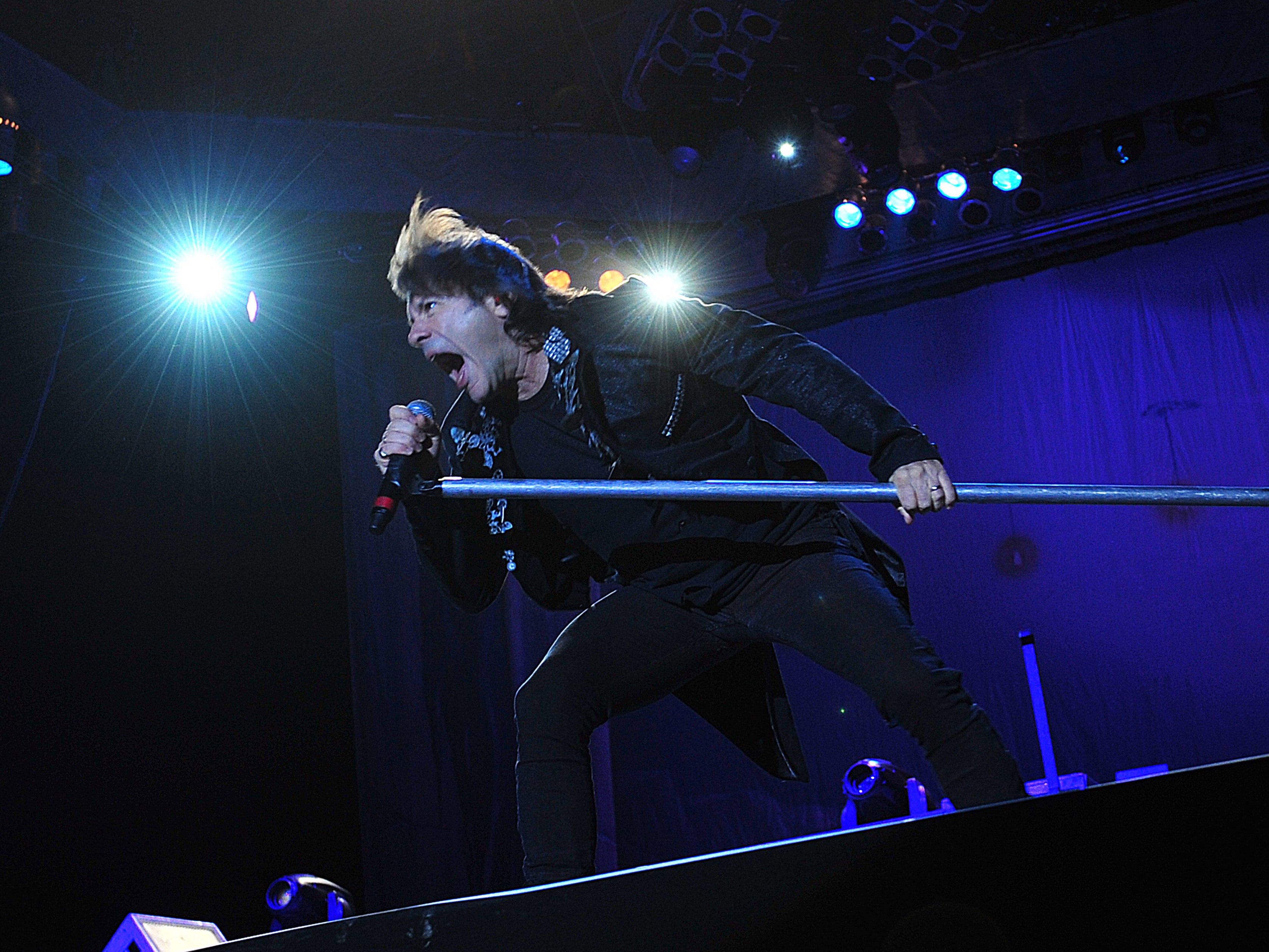 <p>Bruce Dickinson performing during an Iron Maiden gig in Santiago, Chile, in October 2013</p>