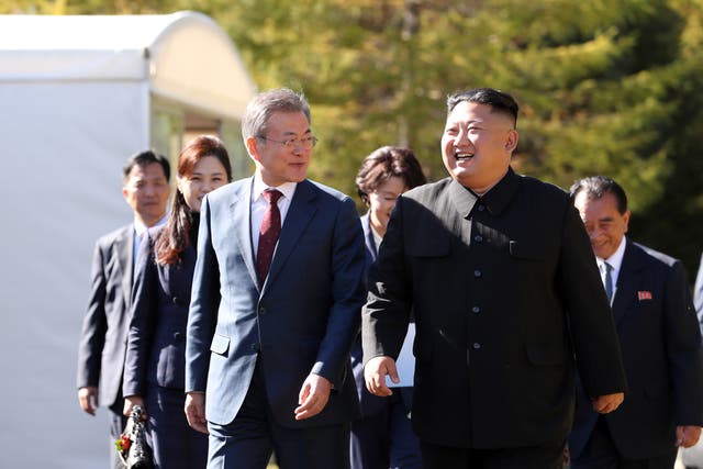 <p>File image: South Korean President Moon Jae-in and North Korean leader Kim Jong-un decided to resume the hotline to improve ties between the two nations </p>