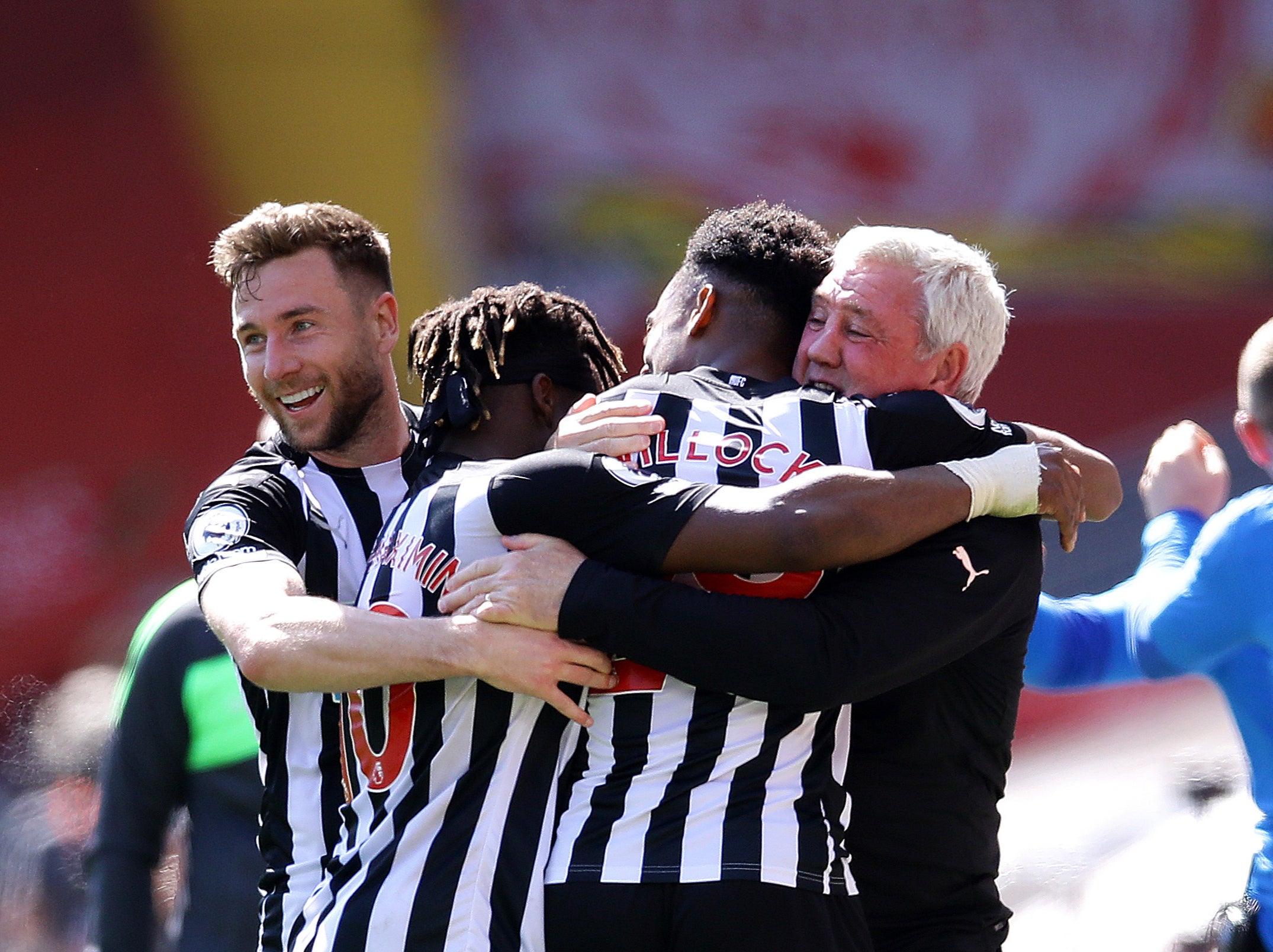 Newcastle players embrace head coach Steve Bruce