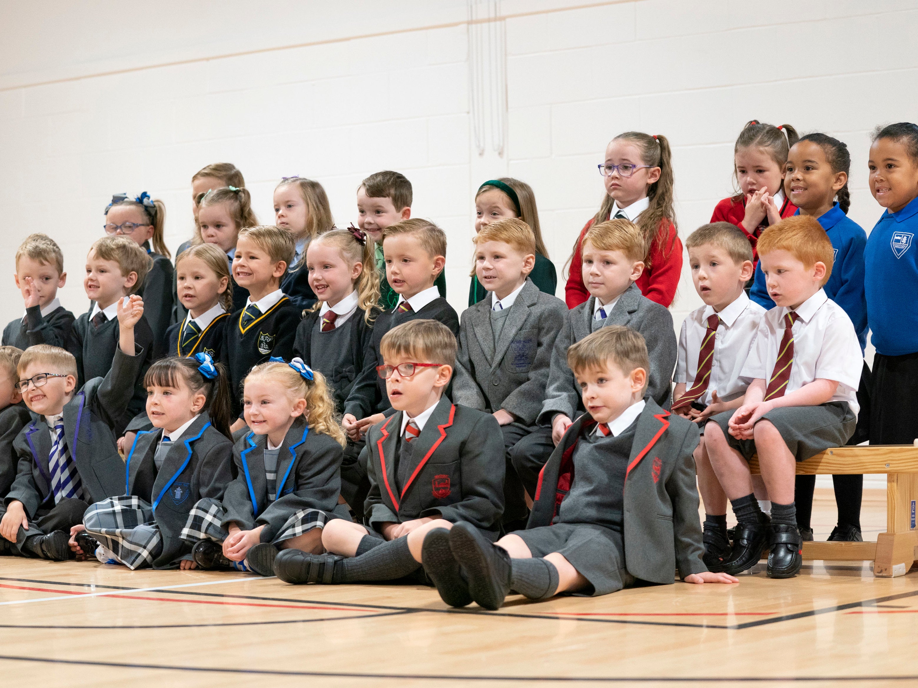 Thirteen sets of twins due to start the new school term in the Inverclyde area pose for a photograph at St Mary's Primary School in Greenock