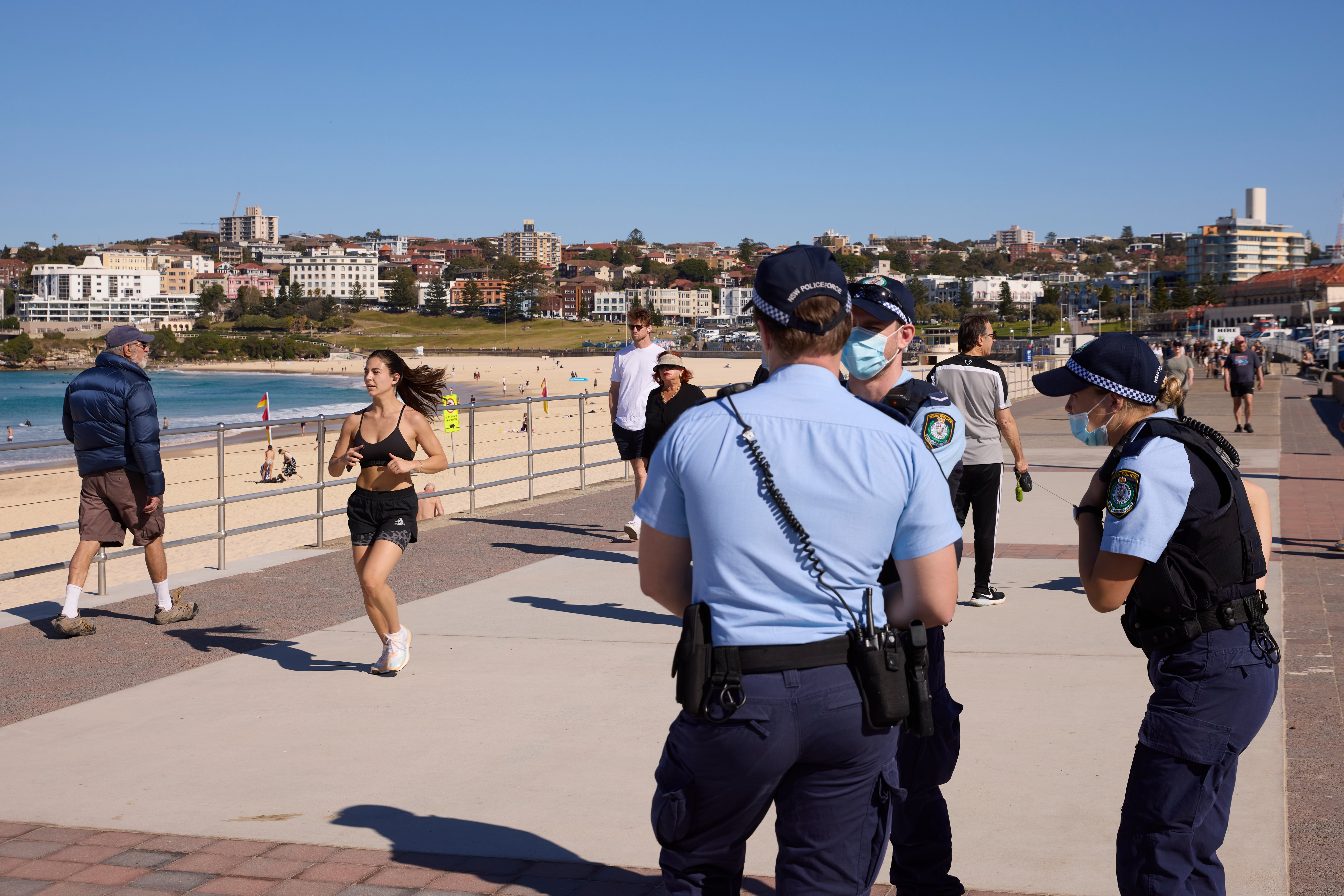 Police patrol at Bondi Beach in Sydney as residents continue to live under lockdown conditions