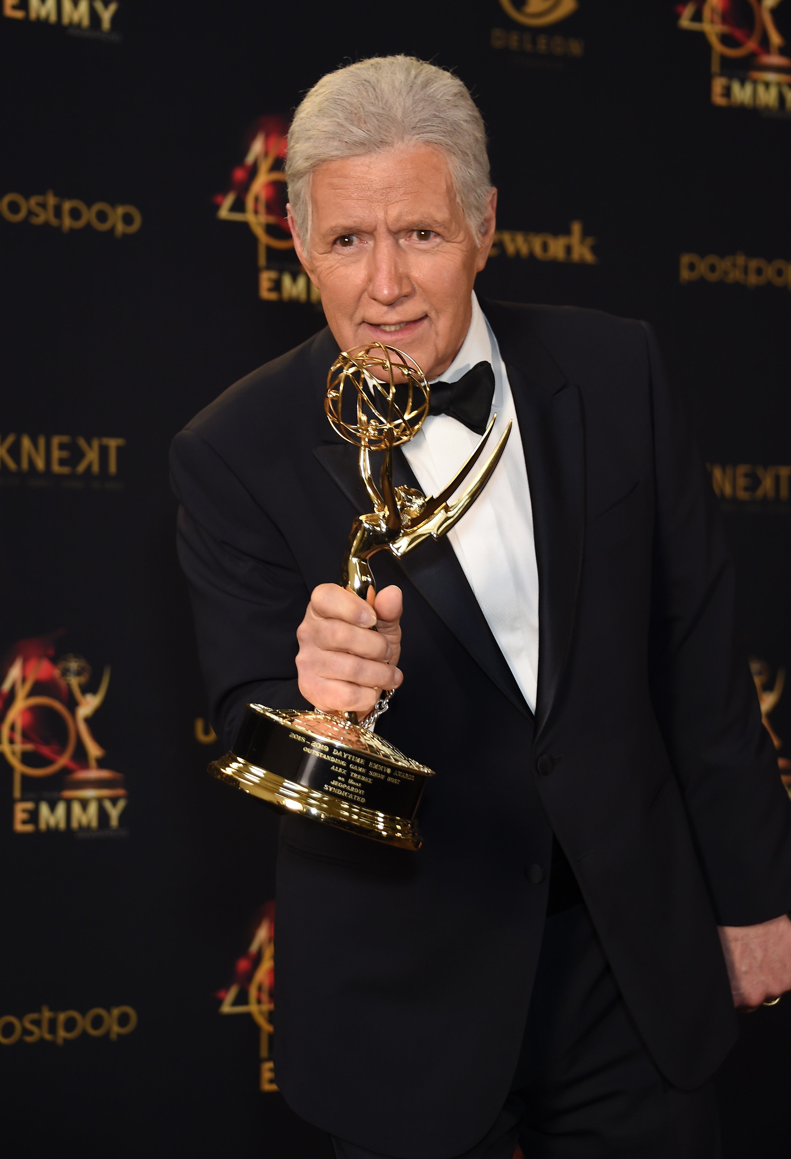 Alex Trebek poses with the Daytime Emmy Award for Outstanding Game Show Host for his work on ‘Jeopardy!’ on 5 May 2019 in Pasadena, California