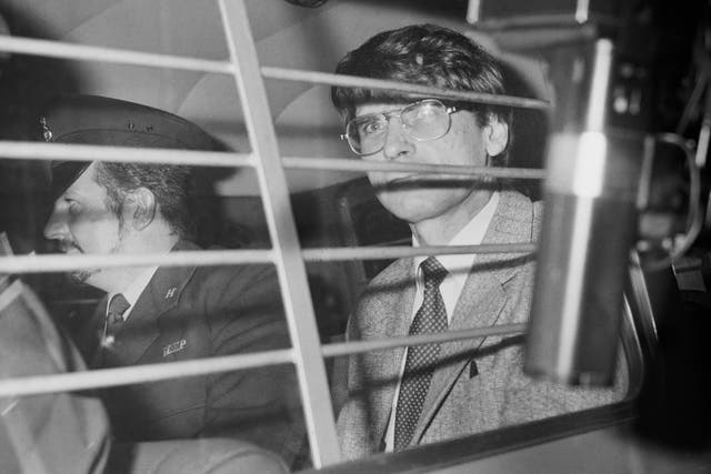 <p>Dennis Nilsen (right) is escorted in a police vehicle on 5 November 1983</p>