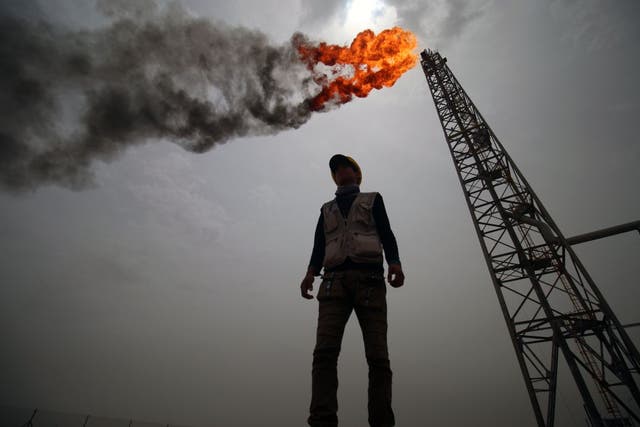 <p>An employee stands at the Hammar Mushrif new Degassing Station Facilities site inside the Zubair oil and gas field, north of the southern Iraqi province of Basra on May 9, 2018</p>