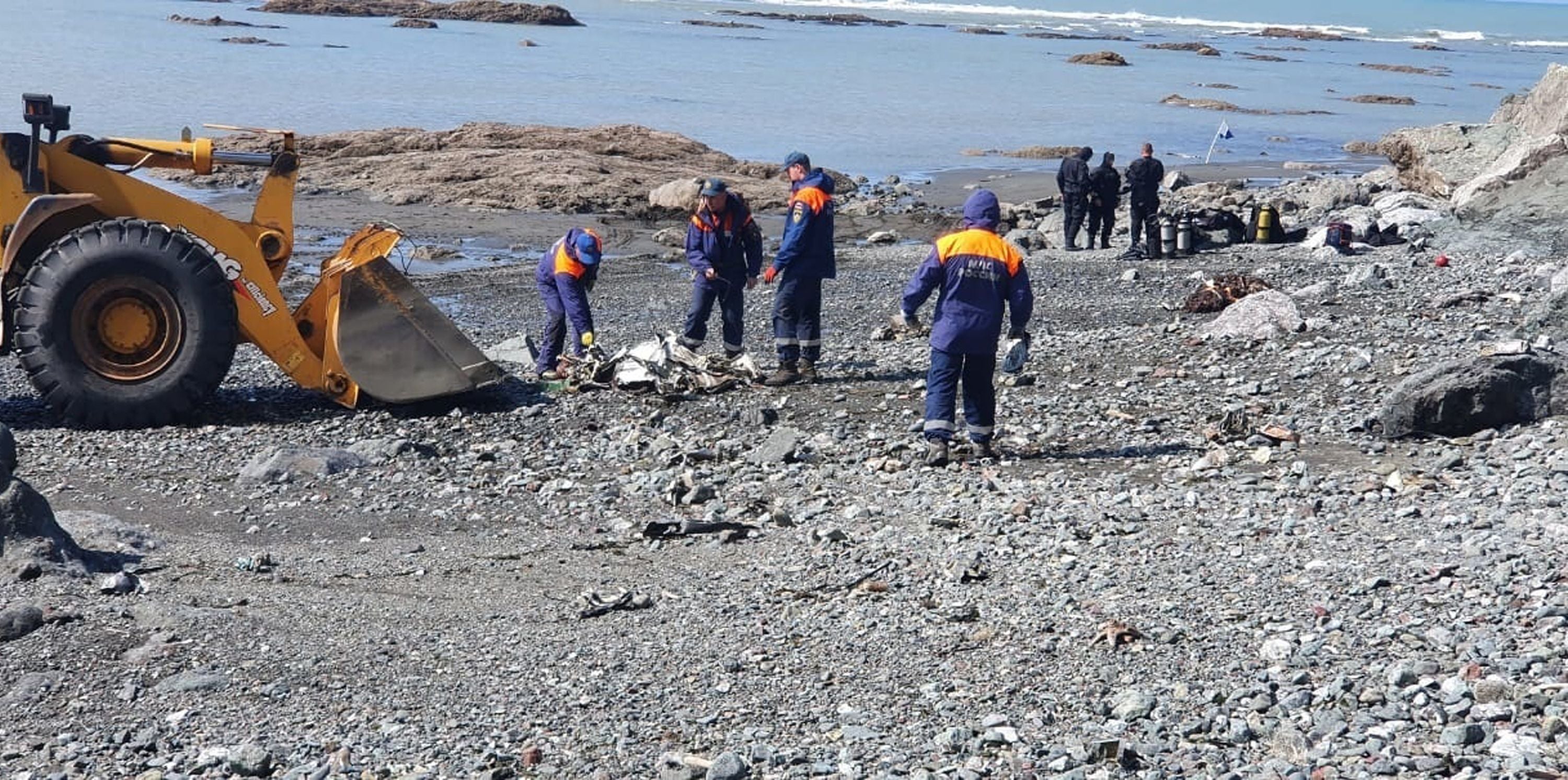 Emergency Situations Ministry workers taking part in the rescue operation at the spot where a Mi-8 helicopter crash-landed into Kuril Lake in the Kronotsky nature reserve on the Kamchatka Peninsula, outside Petropavlovsk-Kamchatsky