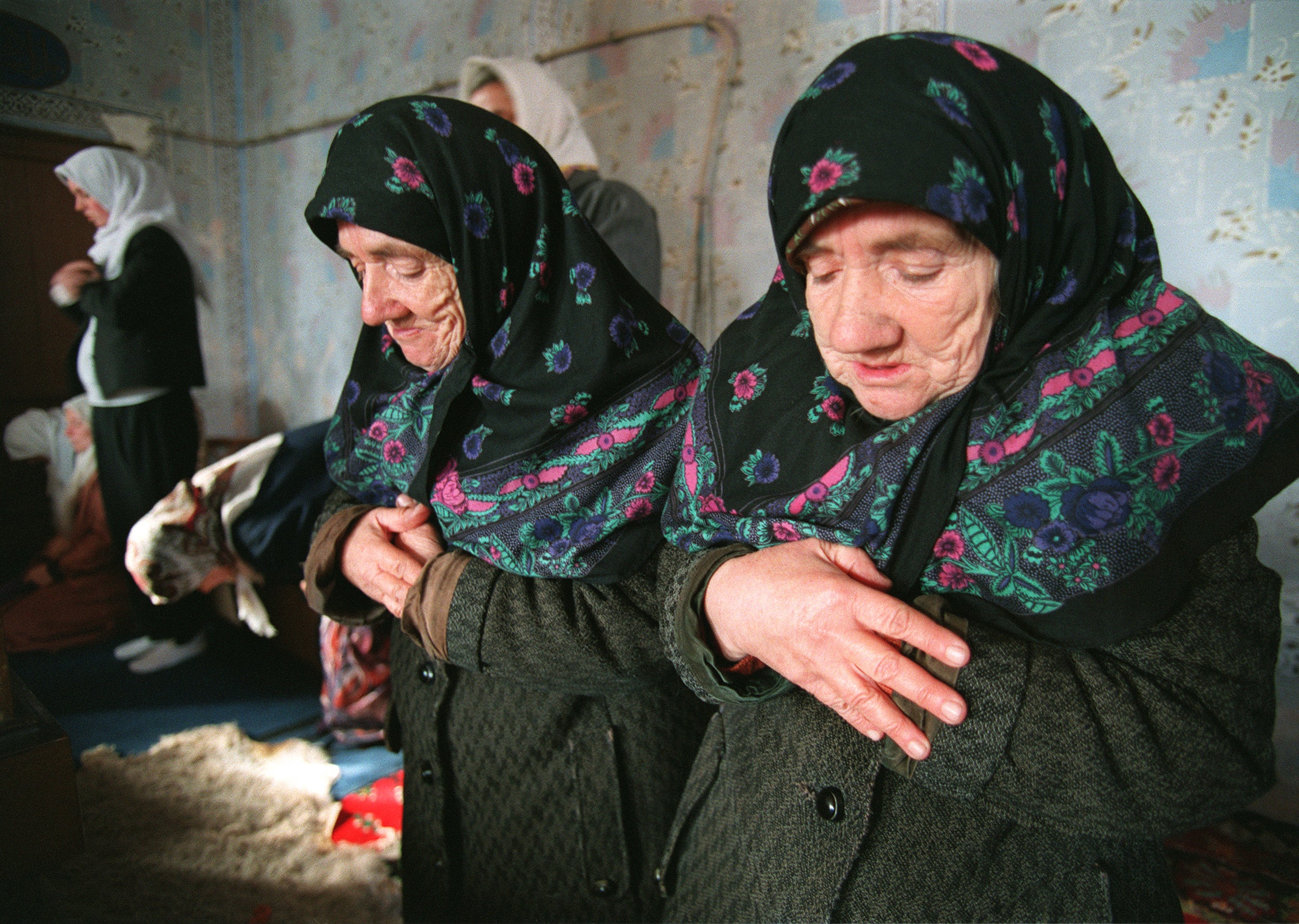 Bosnian Muslim women pray in the mosque of Sarena Dzamida, amid the prospect of a new round of fighting, 4 February 1994