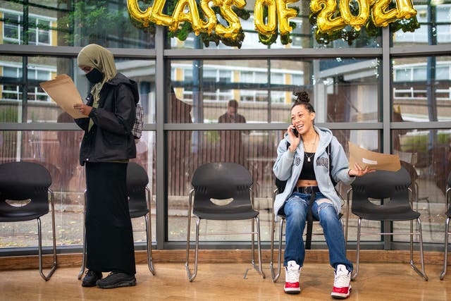 <p>A student shares news of her GCSE results by phone at Ark Burlington Danes Academy in west London</p>