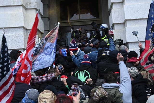 <p>Trump supporters clash with police and security forces as they storm the US Capitol in Washington, DC on 6 January 2021</p>