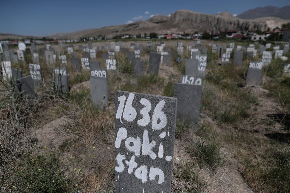 Gravestones of refugees who died crossing the Turkish-Iranian border stand at the 'unidentified' cemetery in Van