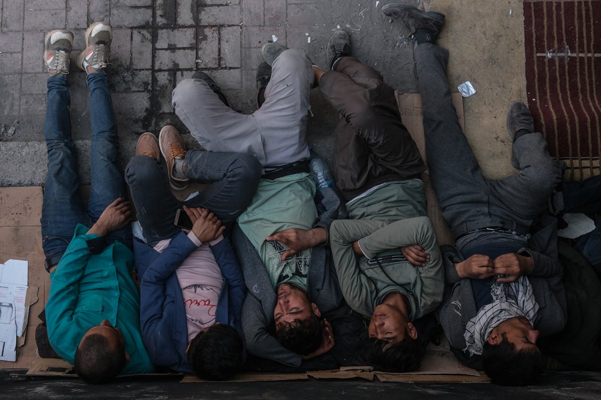 A group of people rest at the bus station in Van city