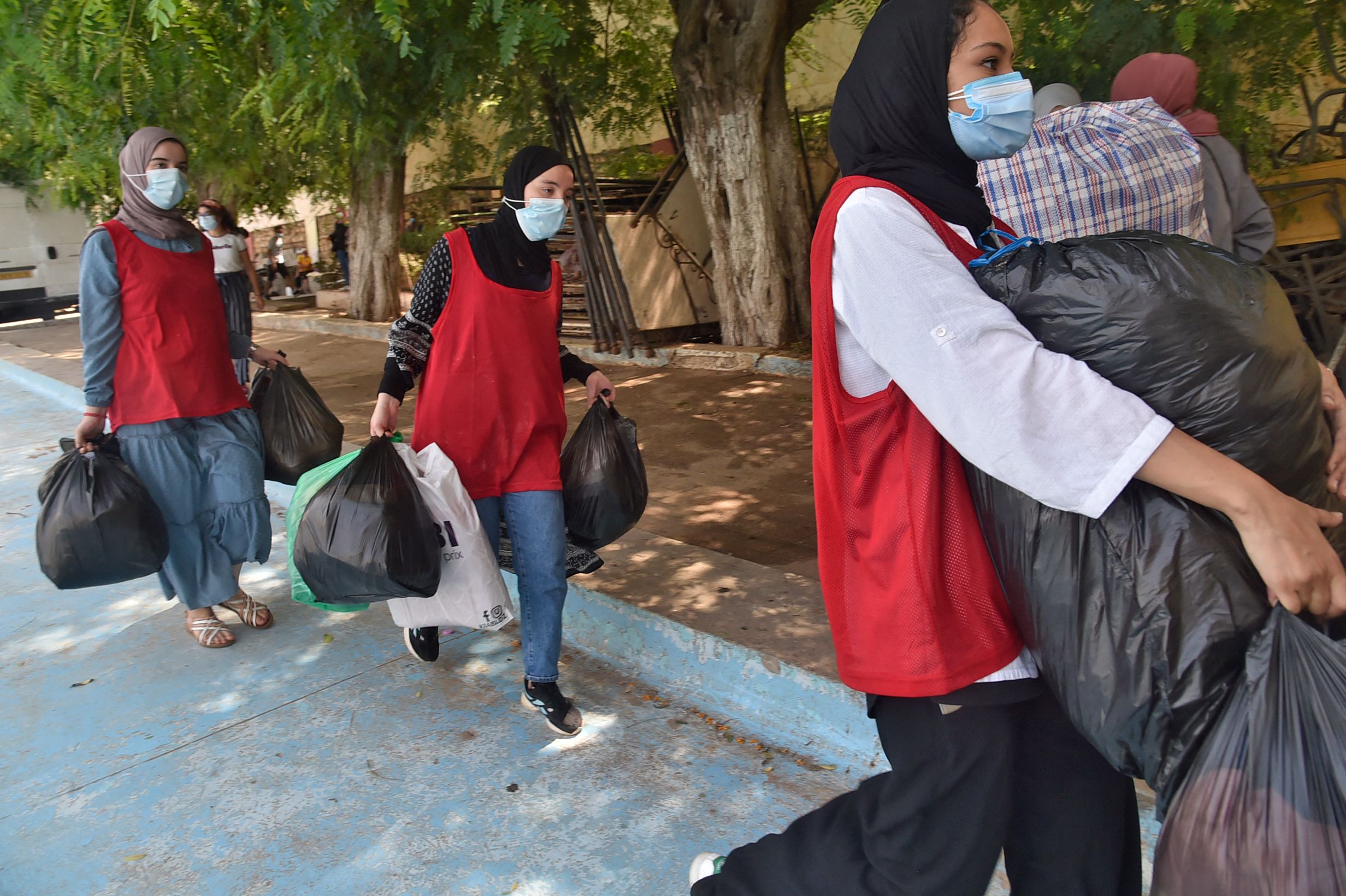 Volunteers gather aid packages to send to victims of the Kabylie region forest fires