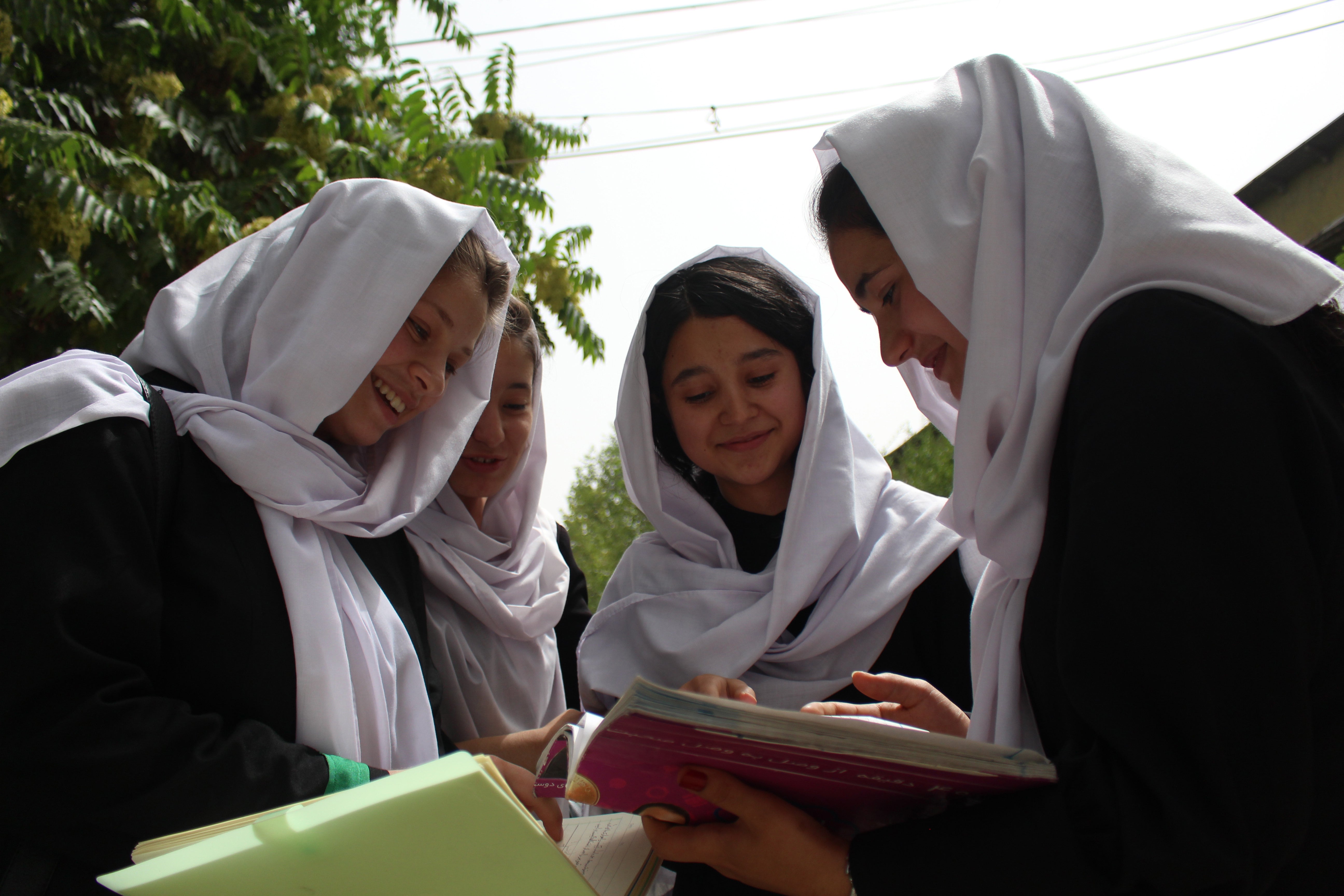 Members of the Best Friends Group at Zarghoona High School, from left: Belqees Niazi, 17, Behishta Amini, 18, and Safia Hussain, also 18, with an unidentified girl second from left