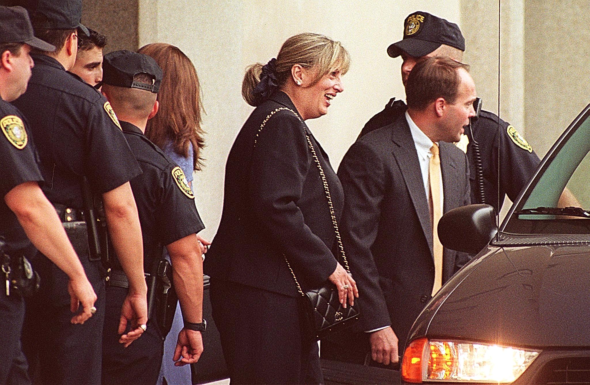 Linda Tripp leaves the US District Courthouse in Washington, DC on 30 June 1998