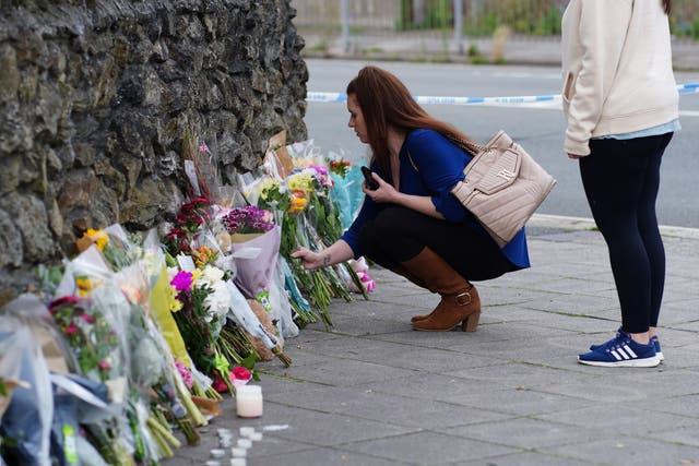 <p>People leave flowers in the Keyham area of Plymouth following Thursday’s shooting </p>