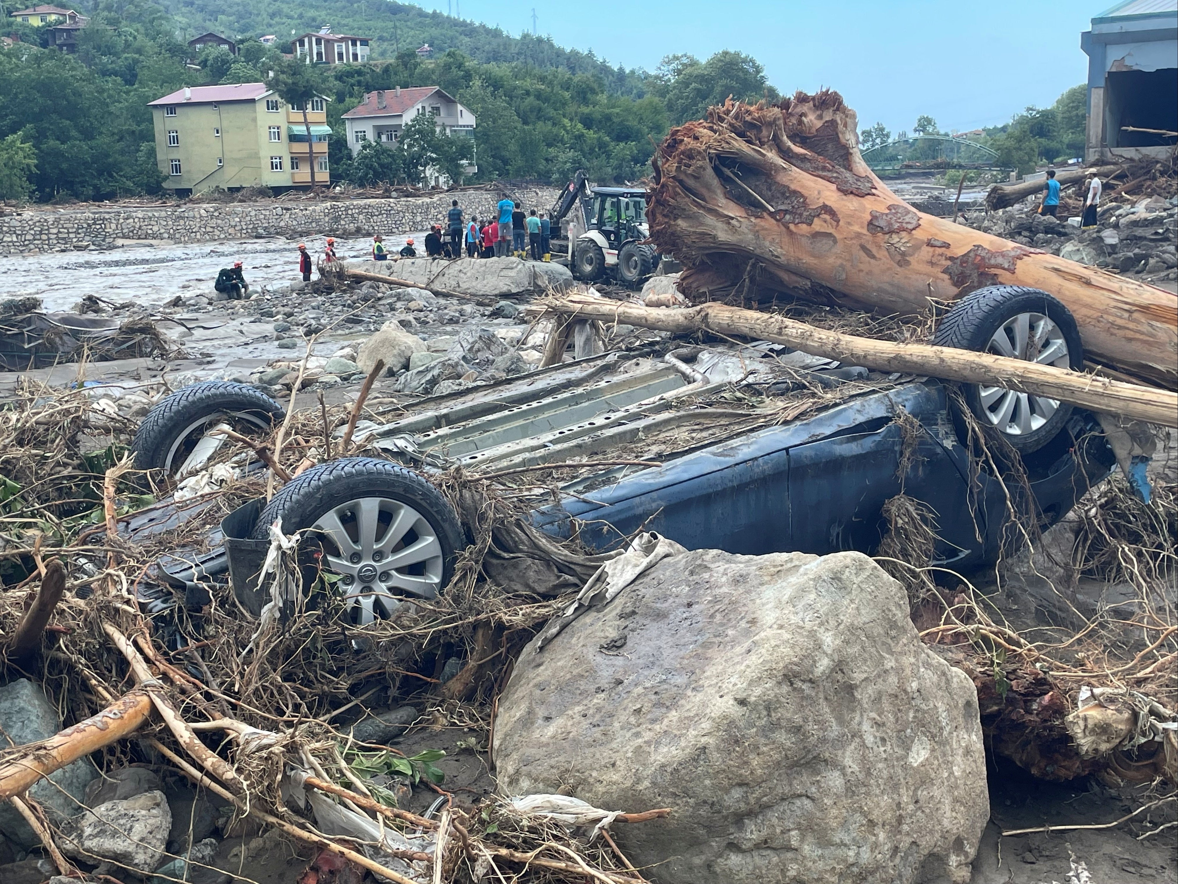 The wreckage of vehicle is seen amid debris in the town of Bozkurt after flash floods swept through the Turkish Black Sea region