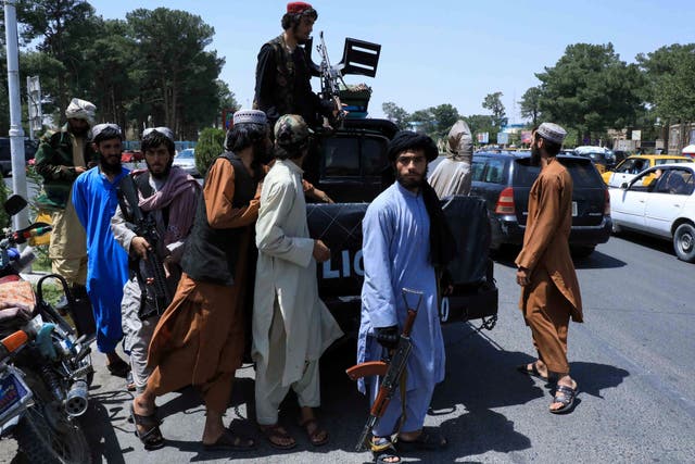 <p>Taliban forces patrol a street in Herat, Afghanistan </p>