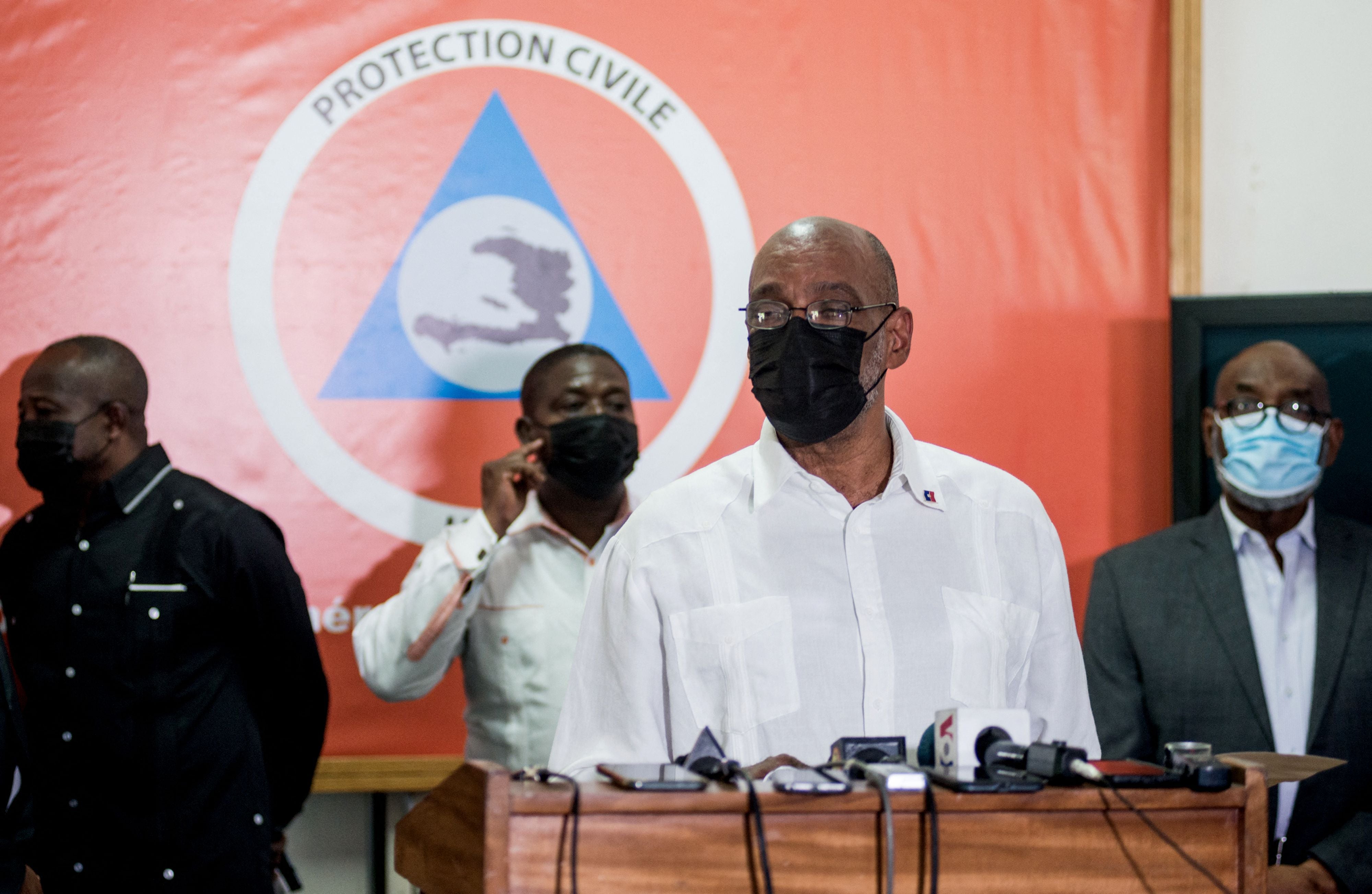 Haitian Prime Minister Ariel Henry speaks during a press conference in Port-au-Prince on August 14, 2021, after an earthquake struck the southwest peninsula of the country.