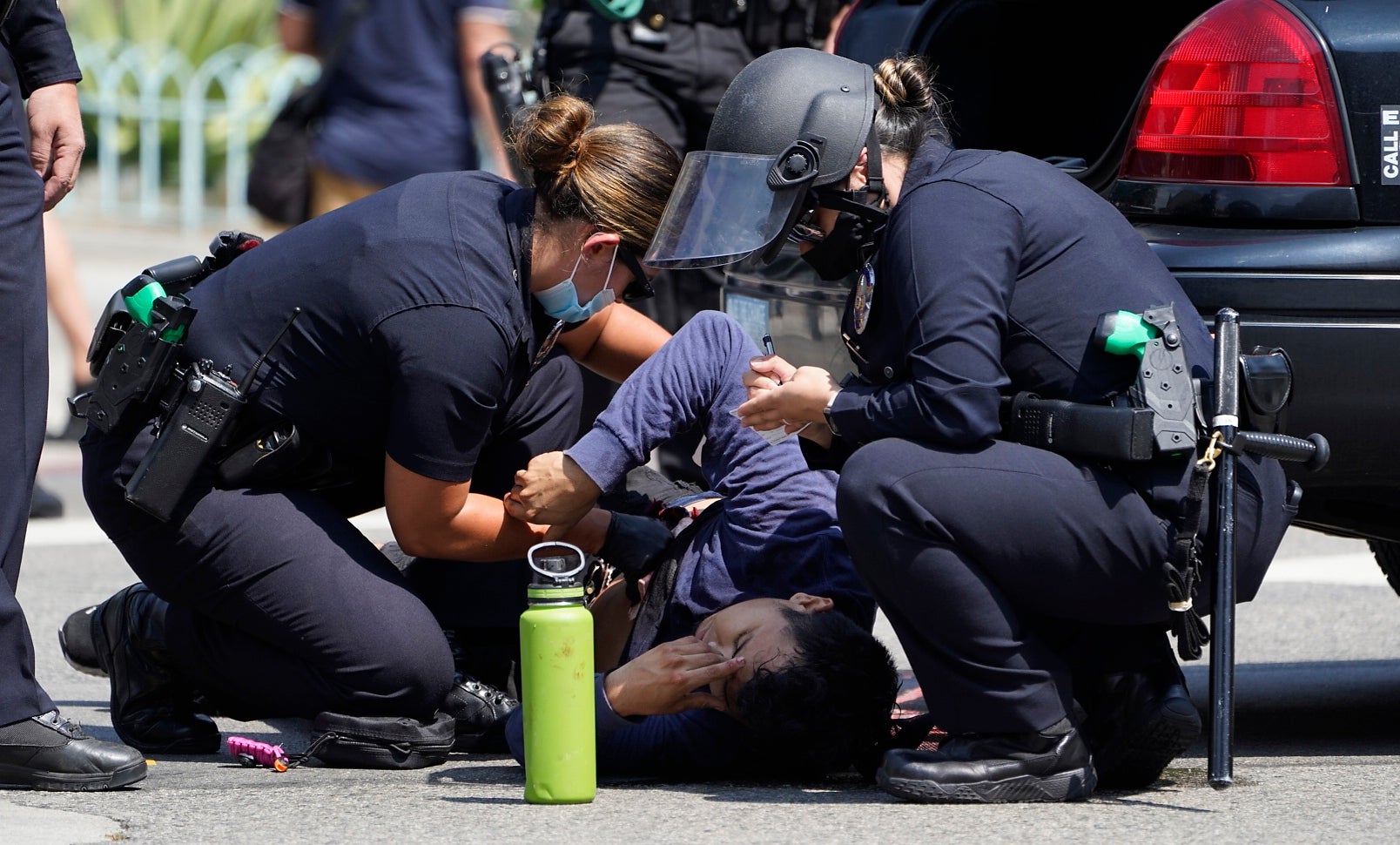 Man stabbed, reporter attacked at protest at LA City Hall | The Independent