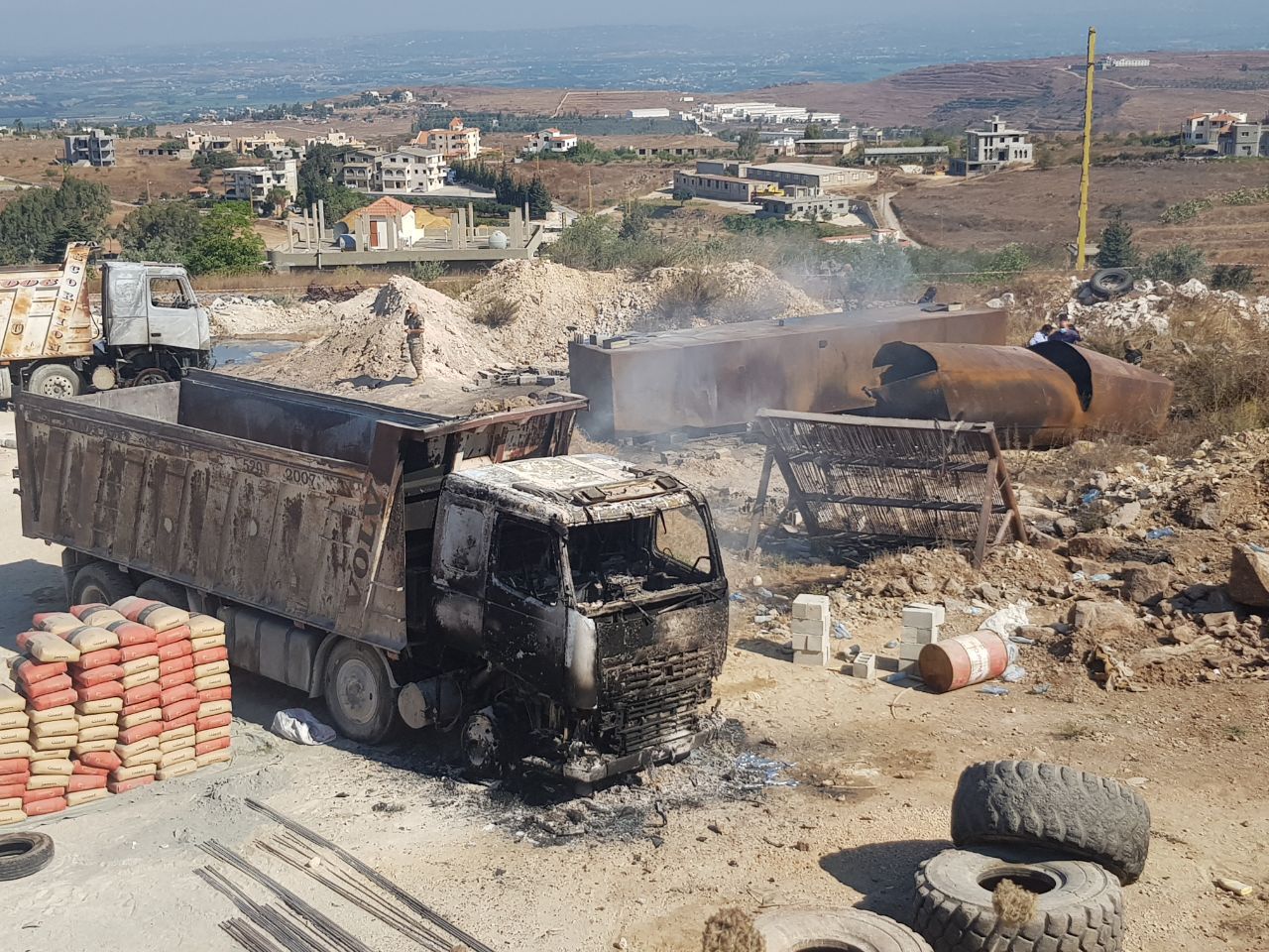 <p>A view from the scene after dozens were killed and injured when a fuel tanker exploded in the Akkar region of northern Lebanon</p>