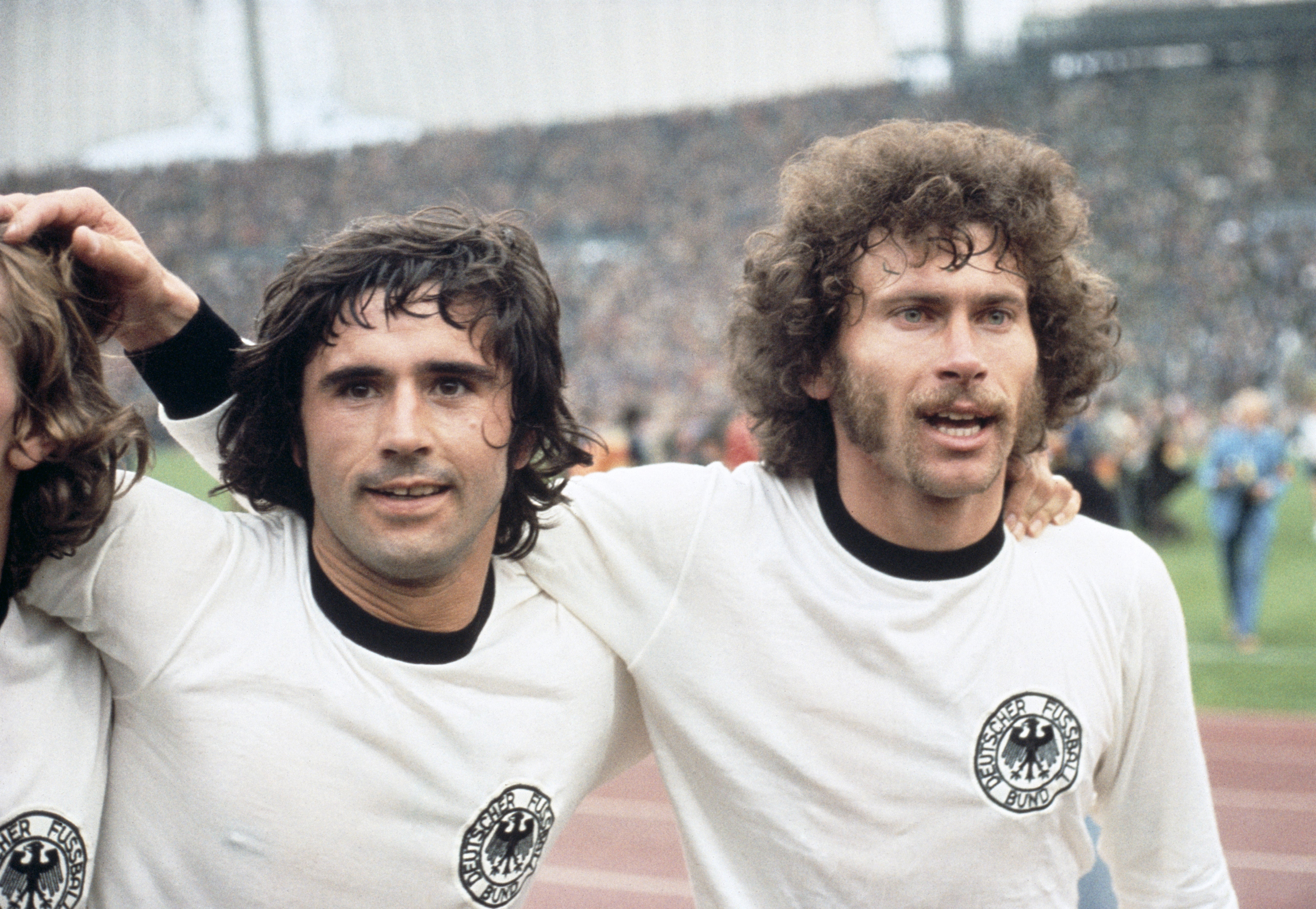 Gerd Muller (L) with Paul Breitner (R) in 1974 after defeating the Netherlands at the Olympic Stadium