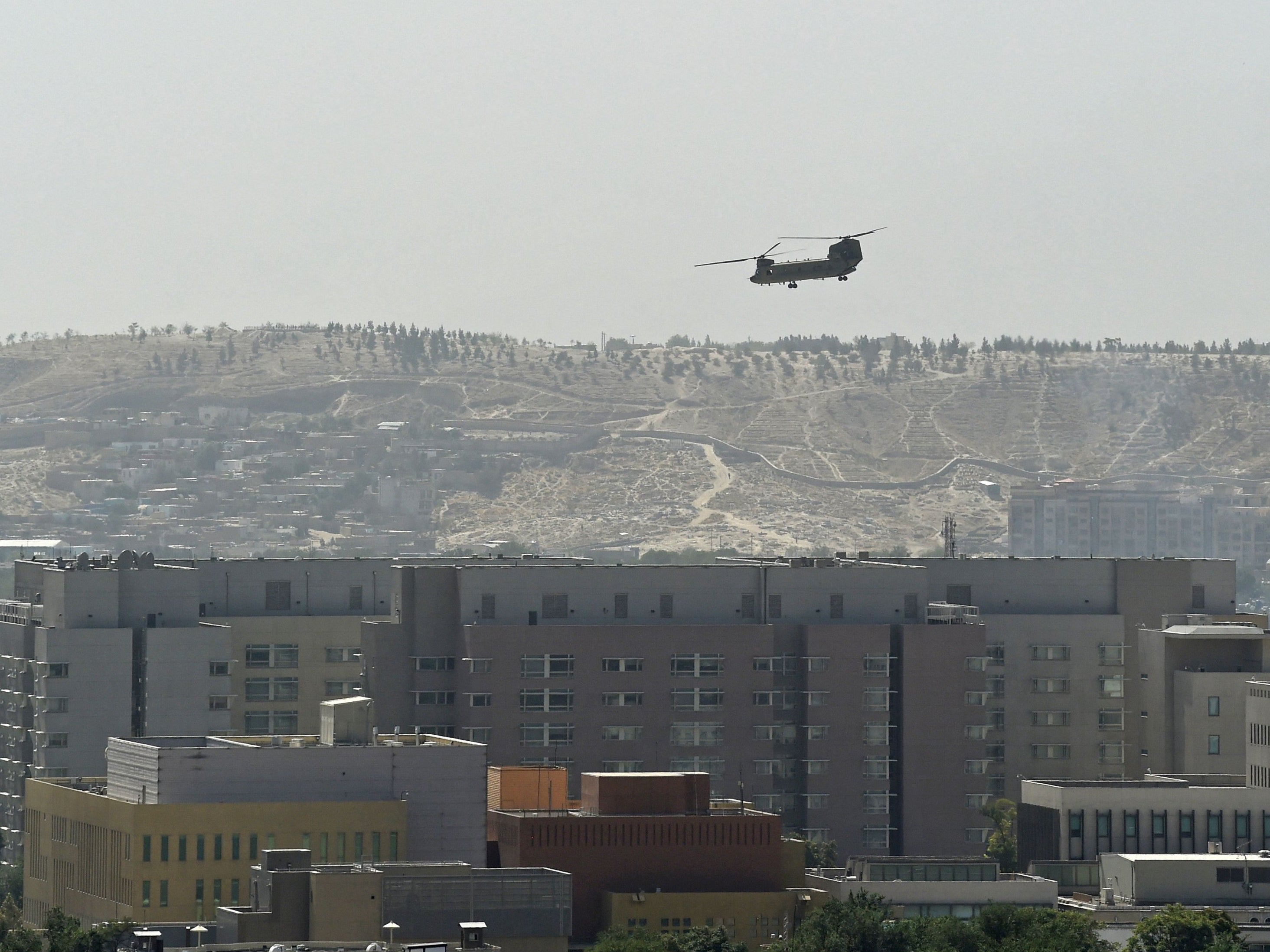 A US military helicopter is pictured flying above the US embassy in Kabul