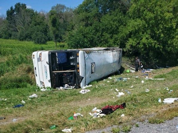 A tour bus en route to Niagra Falls rolled over on the New York State Thruway, injuring all 57 people on board