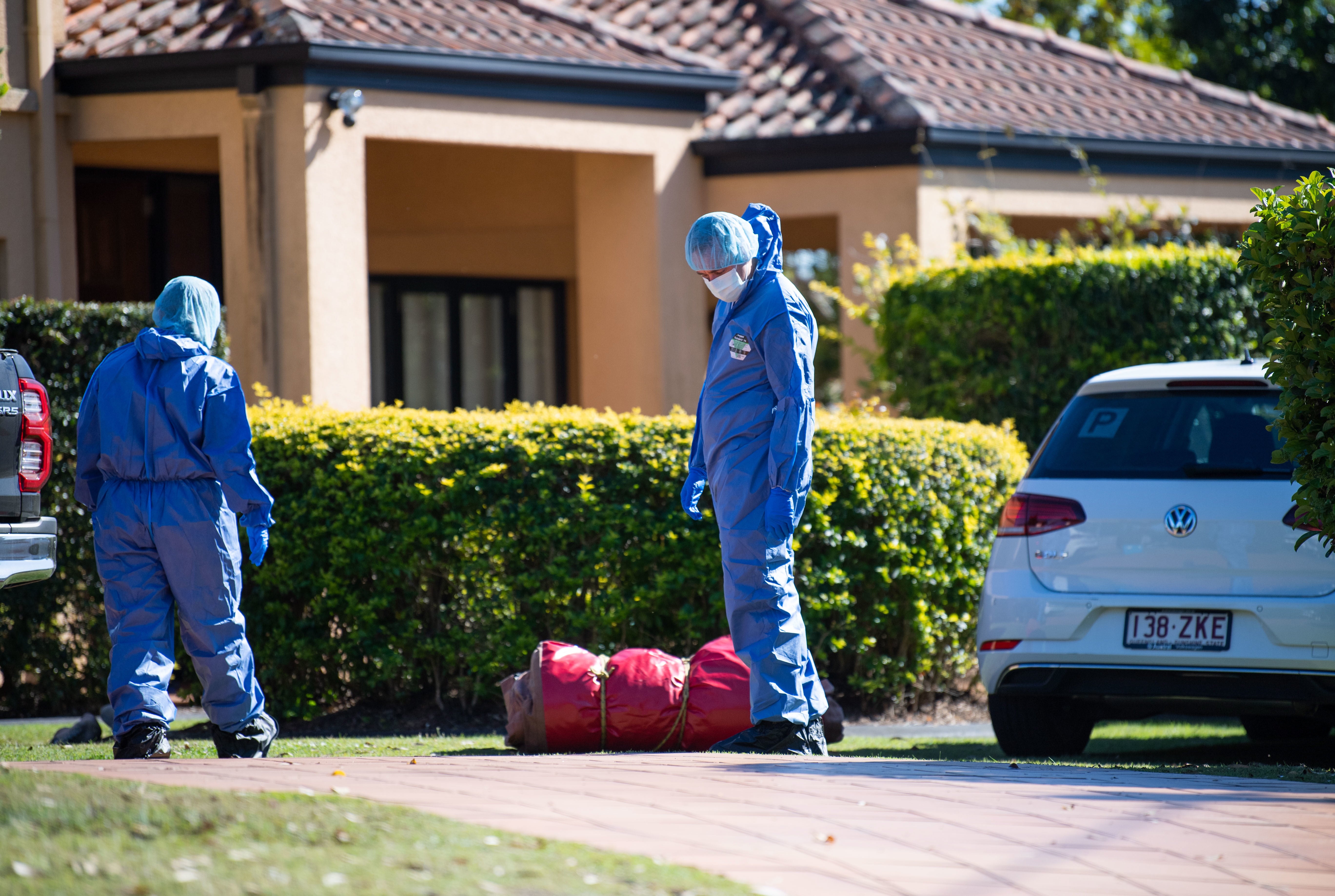 Police forensics officers at the home of Toutai Kefu in Brisbane