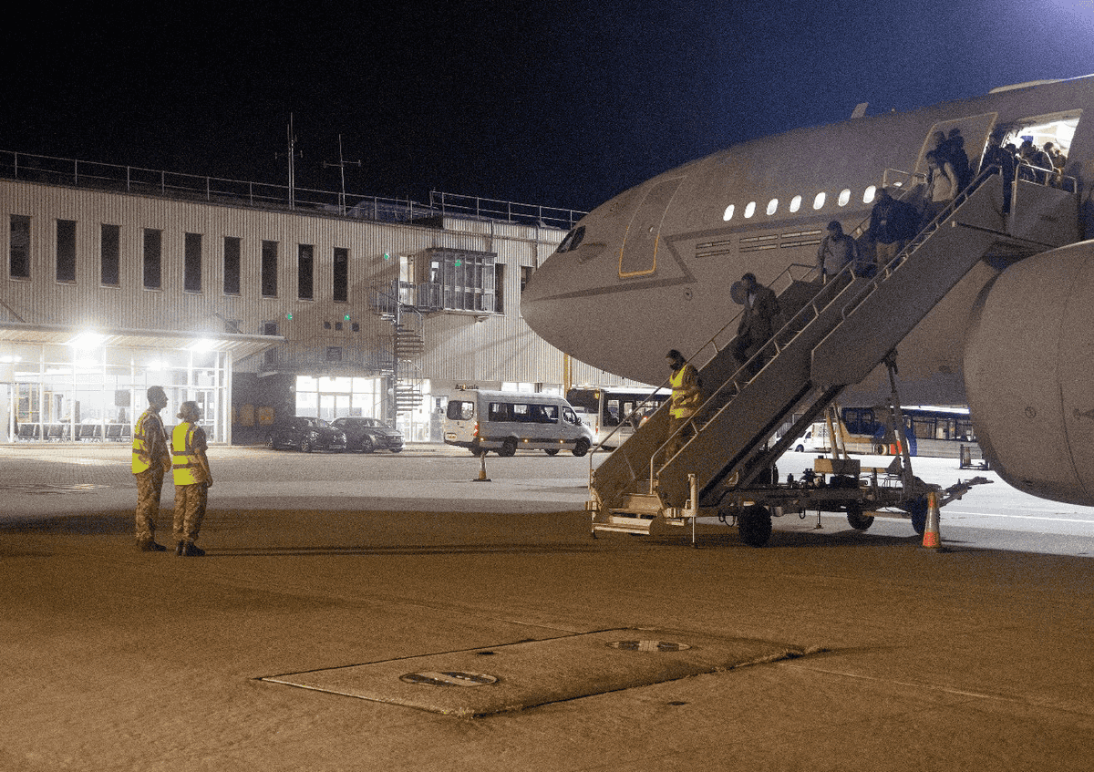 Afghanistan: First flight carrying evacuated British citizens arrives in UK Afghanistan: First flight carrying evacuated British citizens arrives in UK