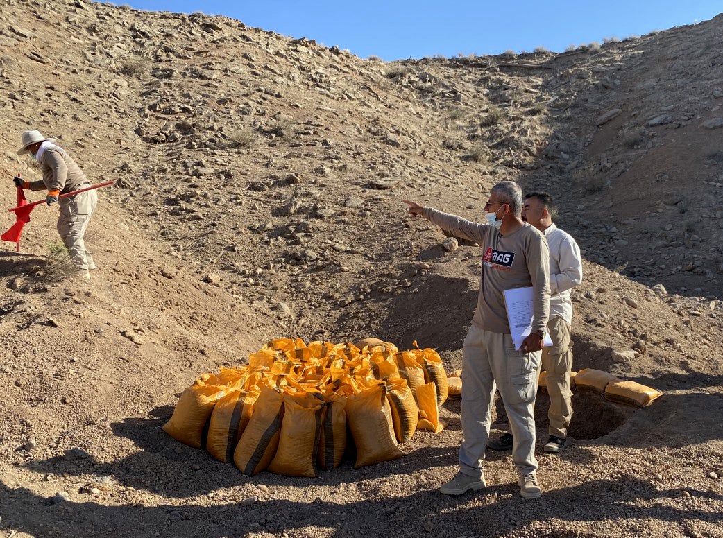 Chalak Taha in the desert near Laylan, where the operatives are destroying the devices found during the previous week