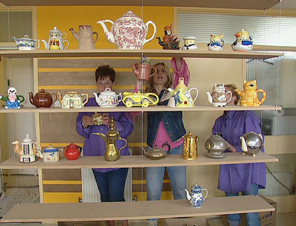 Designer Linda Barker installed a set of hanging shelves to display a prized teapot collection