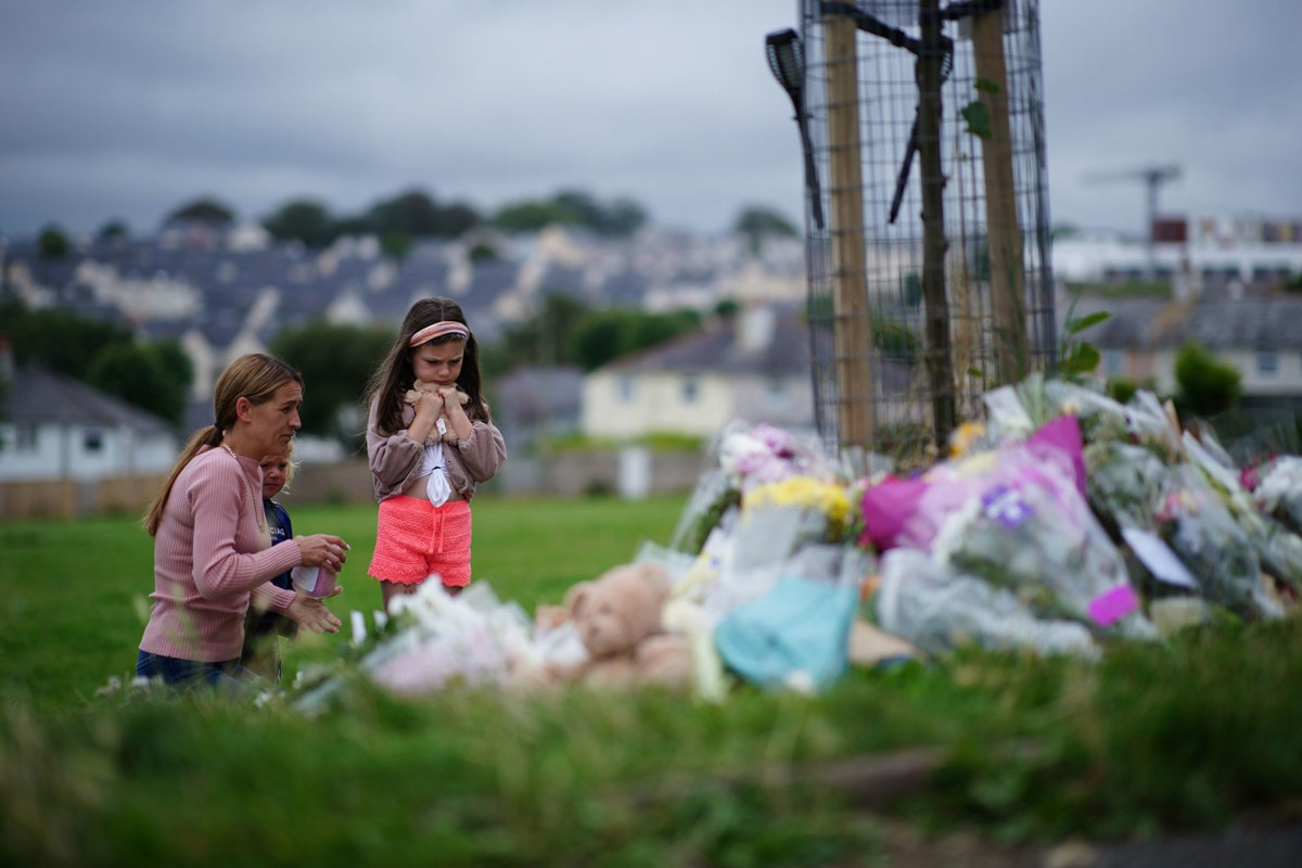 Tributes are laid in Plymouth in August 2021, after Jake Davison killed five people and then turned the gun on himself